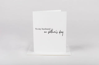 Greeting card with 'To my husband on father's day' text on a white background