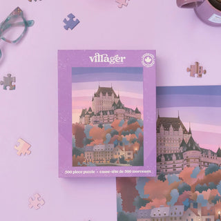 A 500-piece jigsaw puzzle box by villager, featuring an illustration of a castle in a town at sunset, displayed on a light purple background with scattered puzzle pieces.