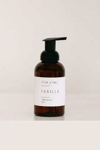 Brown bottle of vanilla scented hand soap on a white background