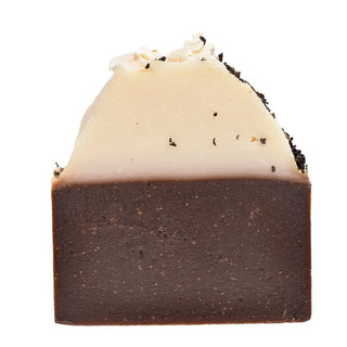 A packaged bar of Vanilla Chai Soap with visible vanilla and spice specks, set against a white background.
