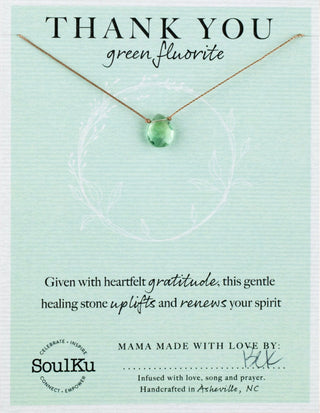 Green fluorite necklace on a green card with 'SoulKu' branding