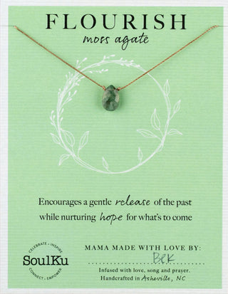 Necklace with green stone pendant on a green card with text and SoulKu branding