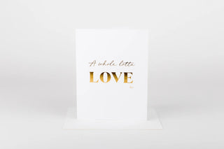 White card with gold text 'A whole lotta LOVE' on a white background