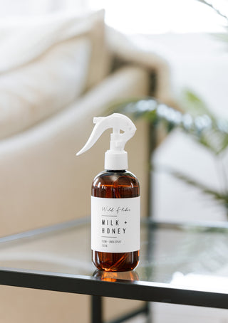 milk & honey room and linen spray on an end table