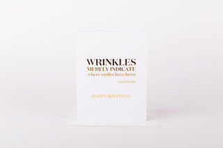 Greeting card with humorous birthday message on a white background