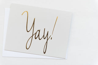 White card with gold 'Yay!' text on a white background