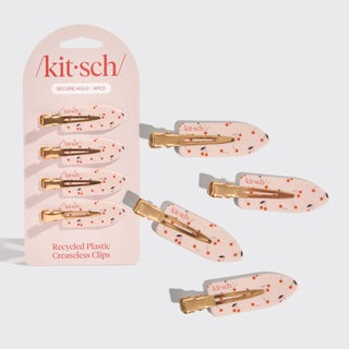 Kitsch hair clips with pink packaging on a white background