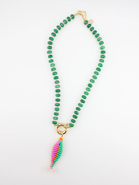 Green beaded necklace with a colorful pendant on a white background