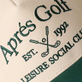 Embroidered text on a fabric surface with 'Apèrs Golf' and 'Leisure Social Club' branding.