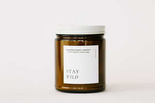 Candle jar with a white label on a light background