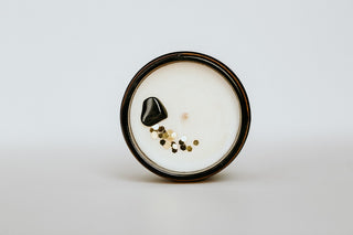 top view of a candle with a crystal in it
