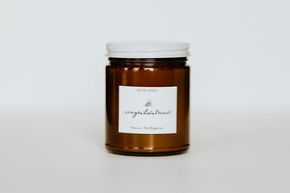 Brown jar with white label on a light gray background