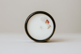 top view of a candle with a crystal in it