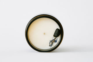 Round ceramic dish with decorative elements on a white background