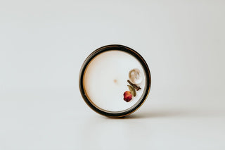 Round ceramic plate with floral design on a white background