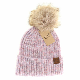 Pink knit beanie with fur pom-pom and C.C tag on a white background