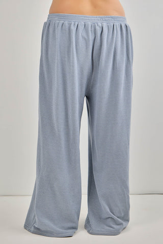 Blue striped pants on a plain background