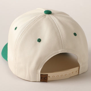 Beige cap with green buttons on a light gray background
