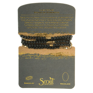 Set of black beaded bracelets on a Scout branded card with gold text.