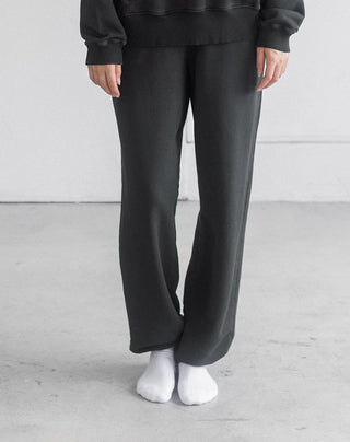 Women wearing an oversized jogger against a neutral photo backdrop. 