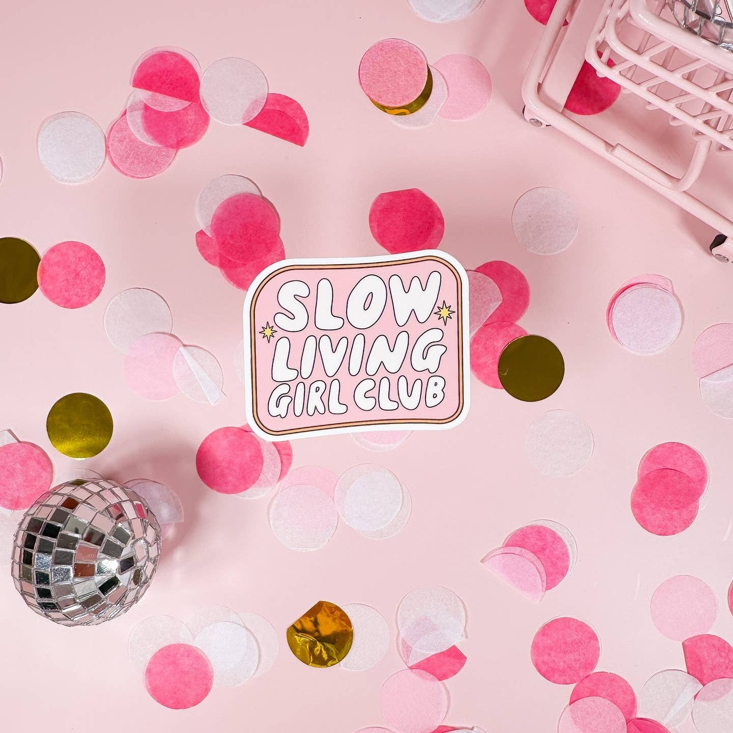 Confetti on a pink background with 'Slow Living Girl Club' sticker