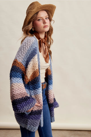 Women wearing a striped chunky knit cardigan 