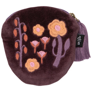 Round purple pouch with floral embroidery on a white background