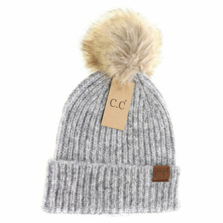 Gray knit beanie with a fur pom-pom and C.C tag on a white background
