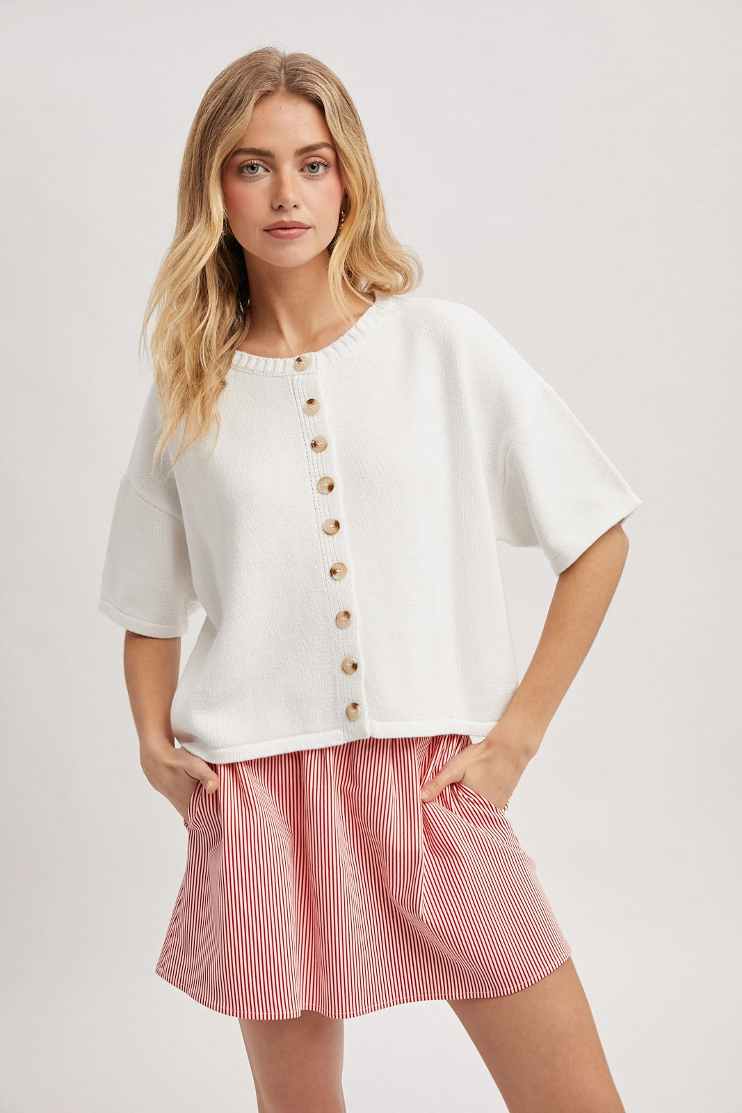 Women wearing a short sleeve button up cardi