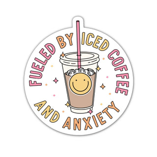 A round sticker with an illustration of a smiling face in a pineapple shape, a cup of iced coffee, and text 'Fueled by Iced Coffee and Anxiety'.
