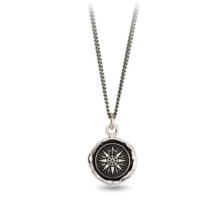 Silver necklace with a black pendant on a white background