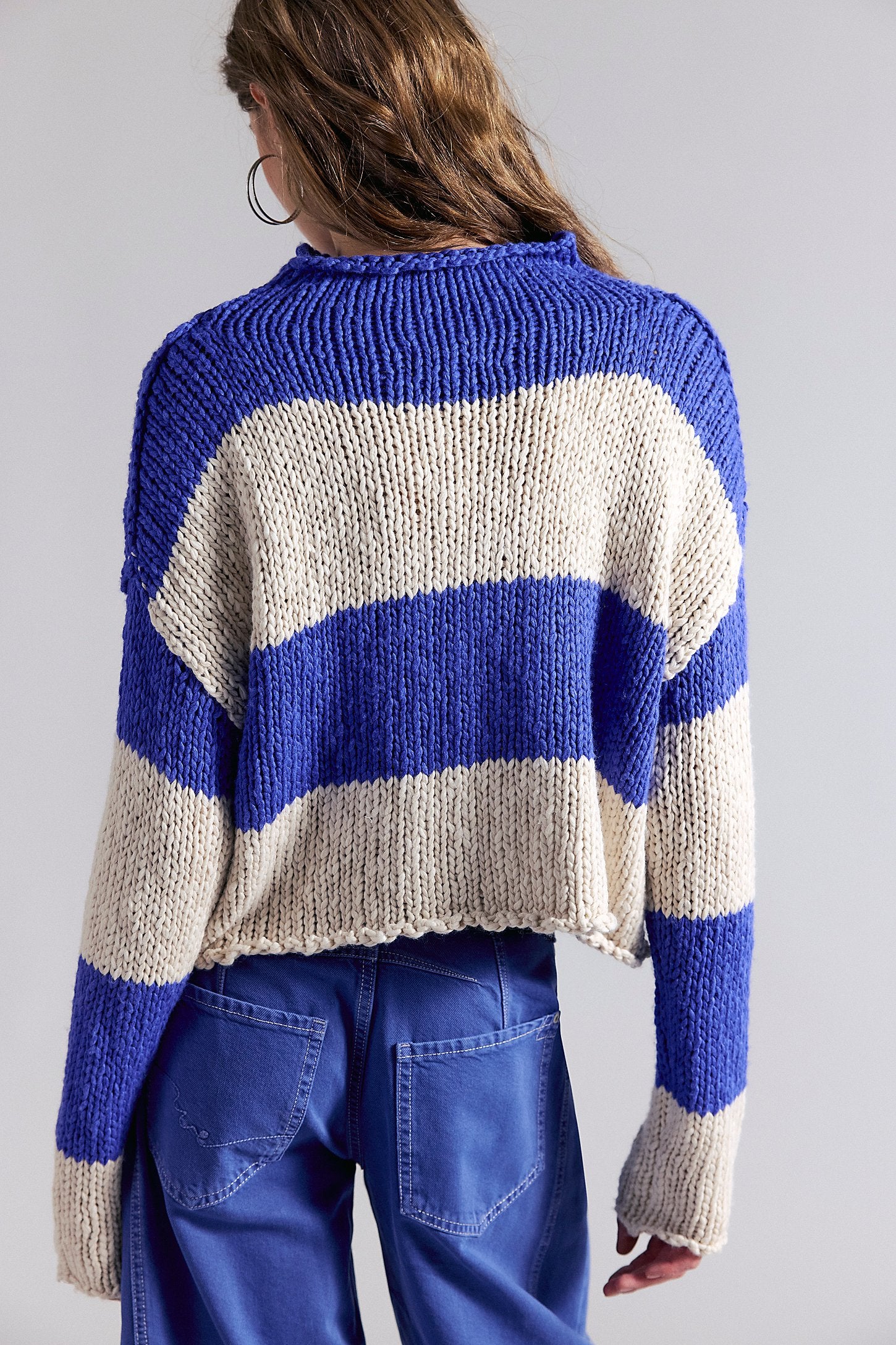 women wearing a blue & white Stripe sweater