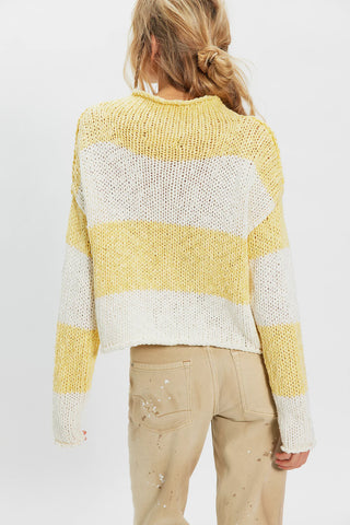 women wearing a yellow & white Stripe sweater