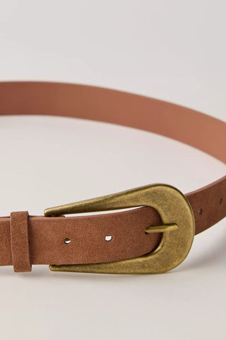 Brown leather belt with a gold buckle on a light beige background