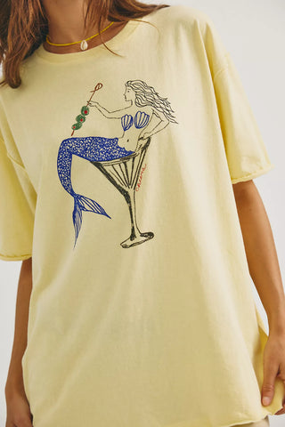 Yellow t-shirt with a mermaid design on a plain background