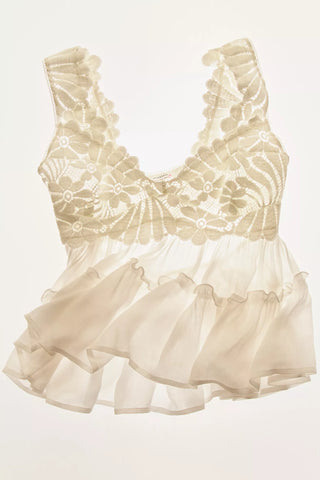 Beige lace top with ruffled layers on a white background