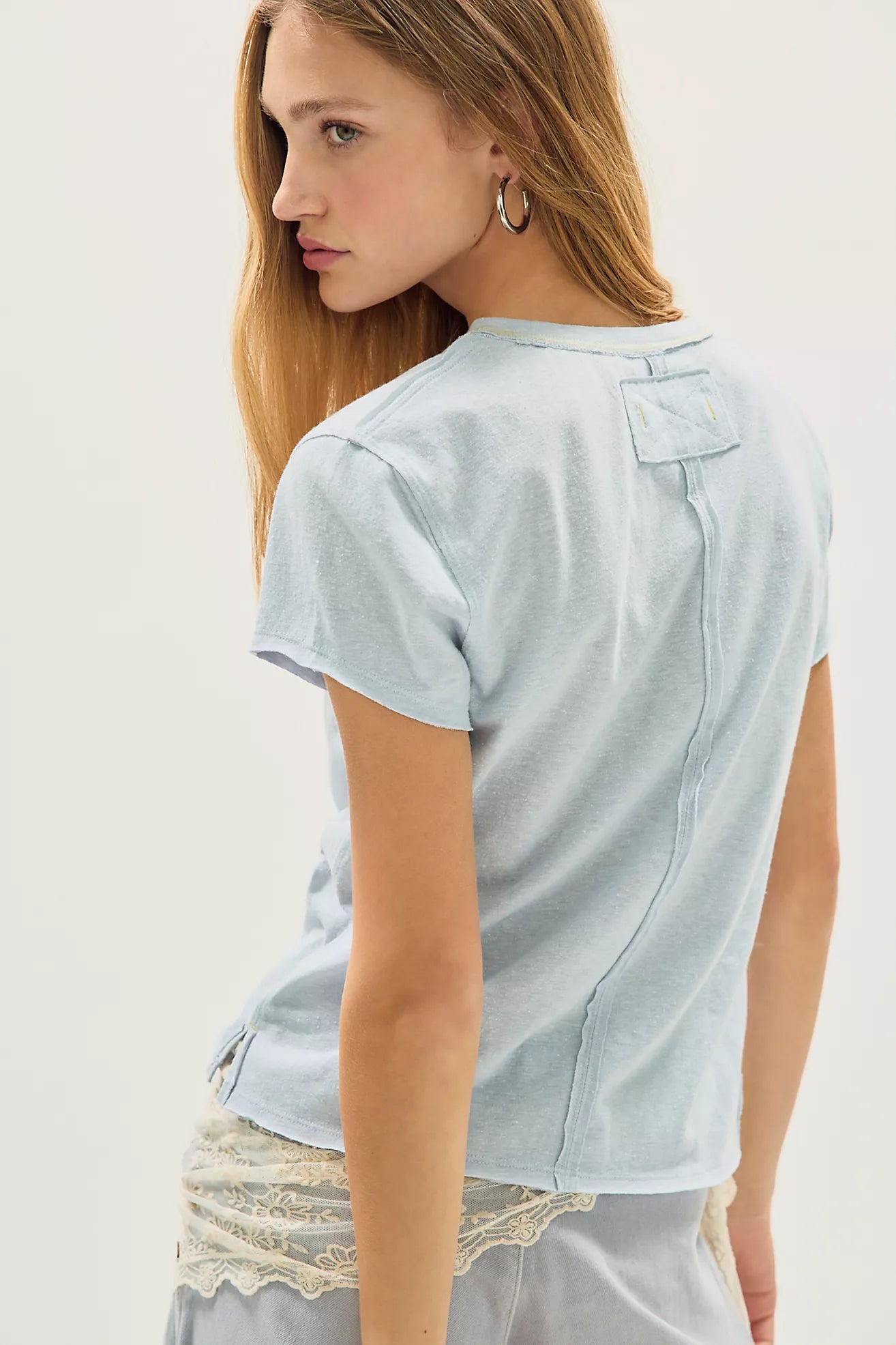 Light blue shirt worn by a person on a white background