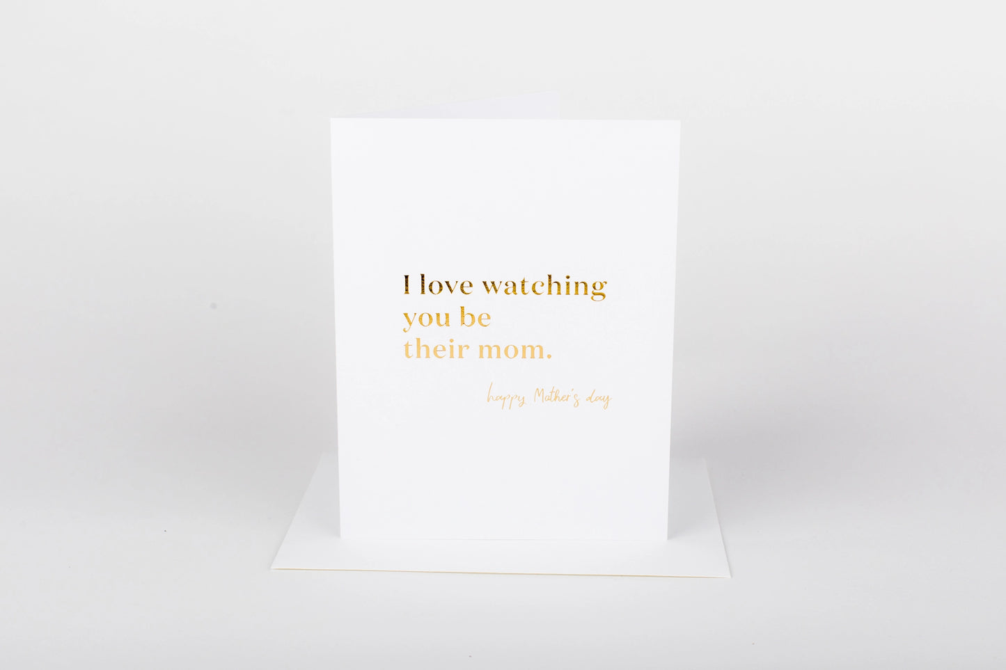 White card with gold text on a white background