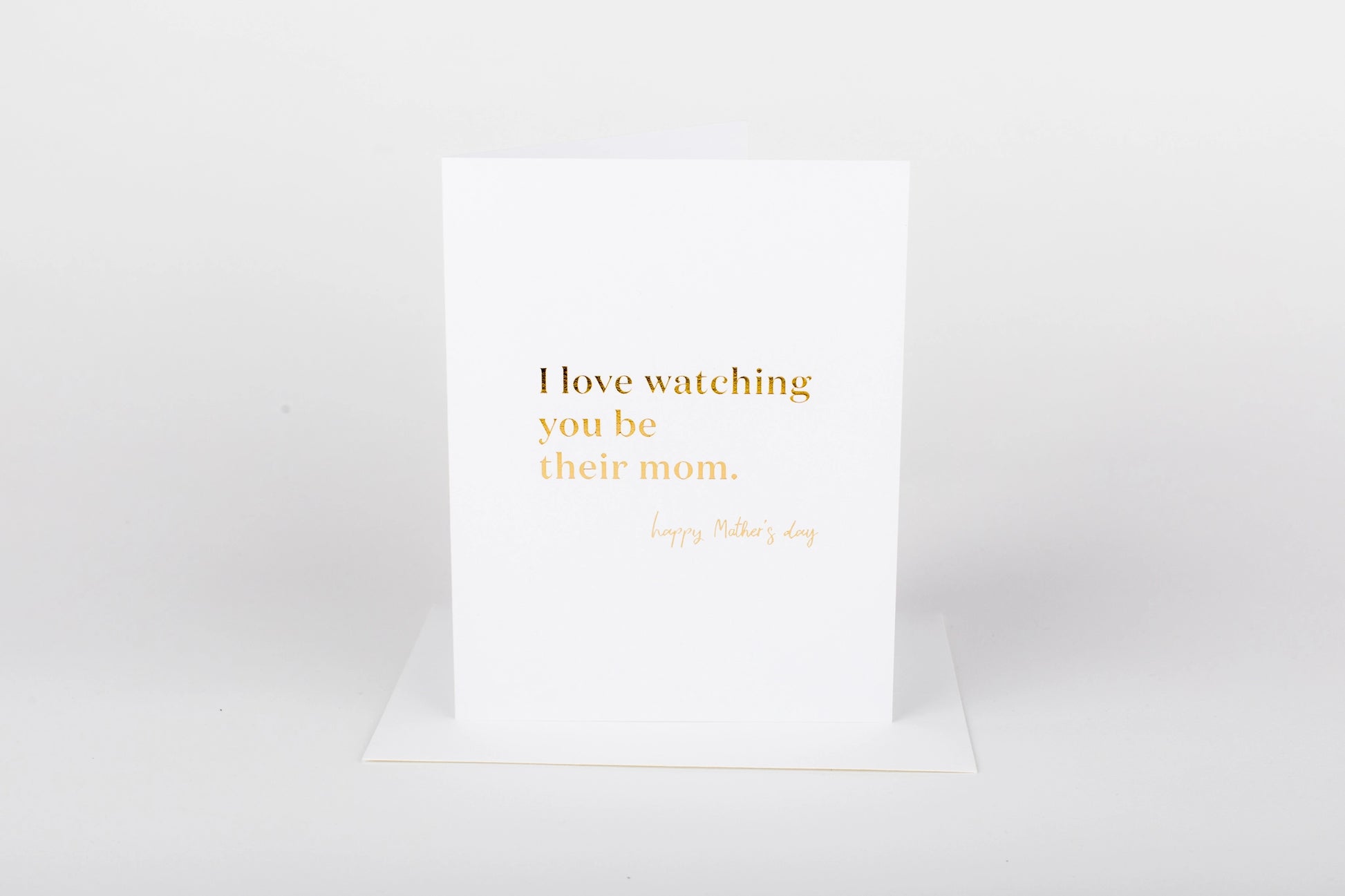 White card with gold text on a white background