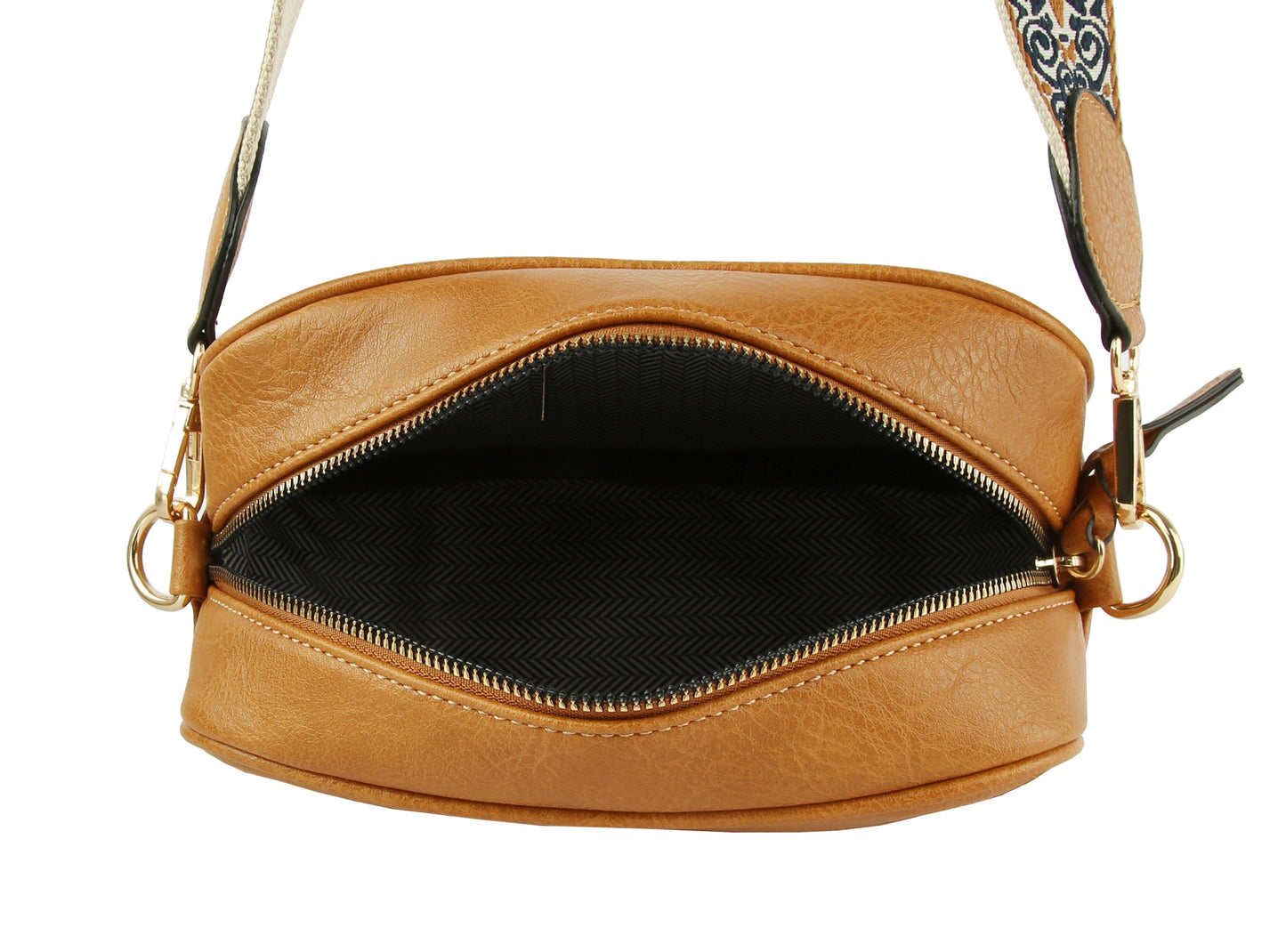 The interior or a crossbody bag on a whit background.