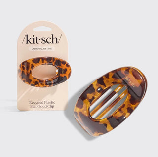 Leopard print hair clip with packaging on a light gray background