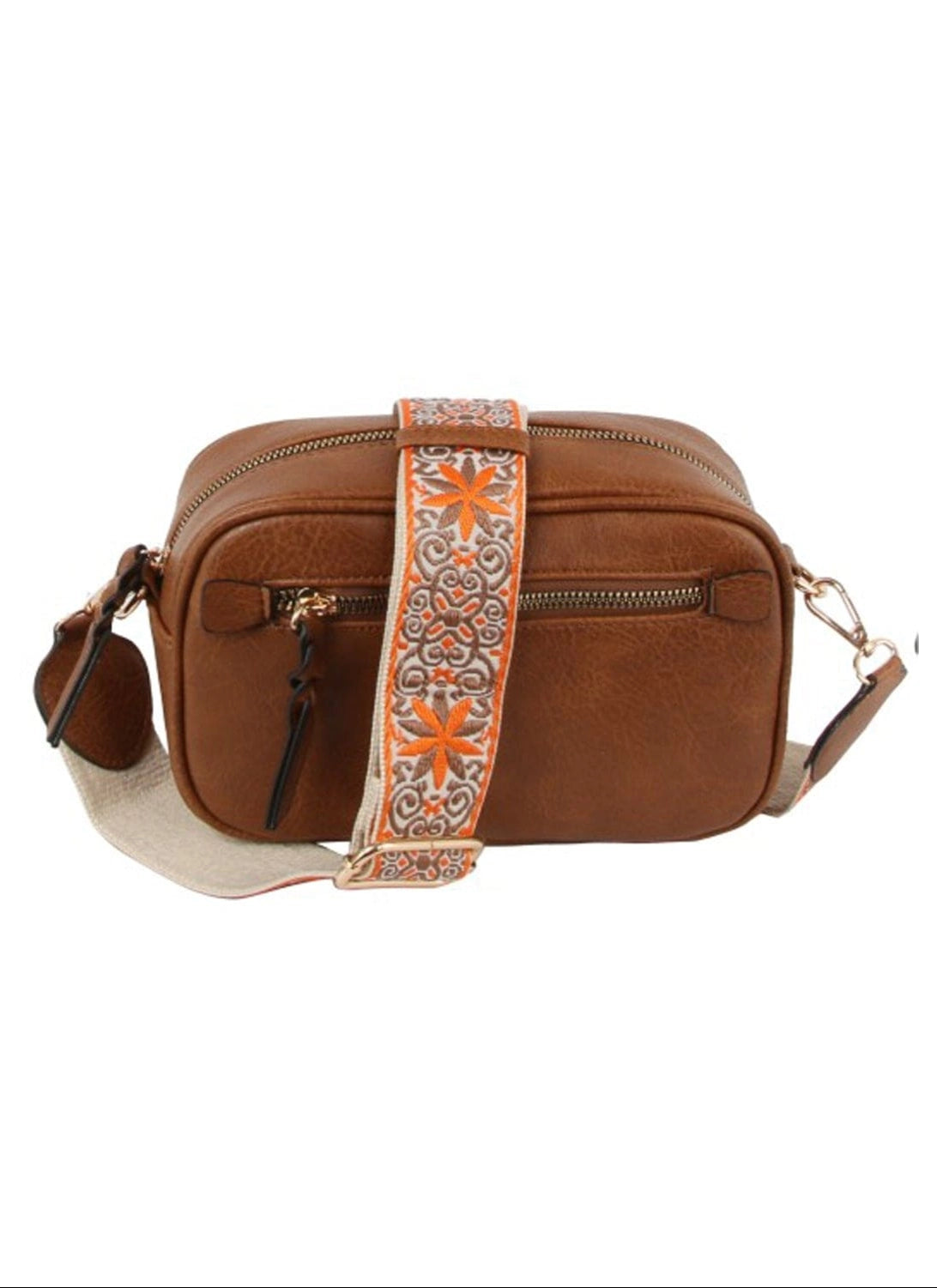 A brown bag with a boho guitar strap on a white background.