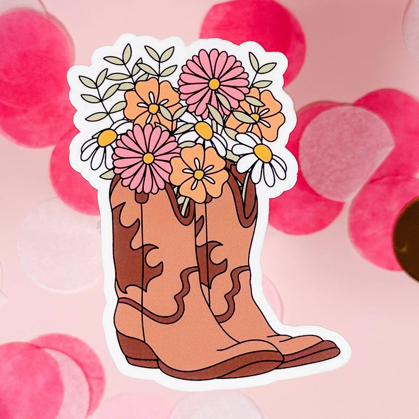 Sticker of a cowboy boot with flowers on a pink background