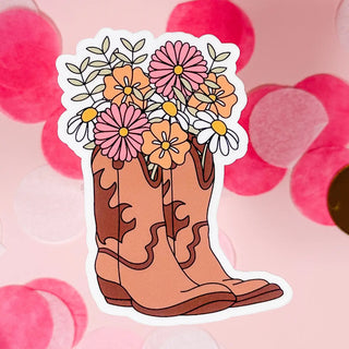 Sticker of a cowboy boot with flowers on a pink background