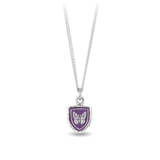 A sterling silver necklace with a purple ceramic talisman pendant featuring a butterfly design, sustainably cast from recycled materials.