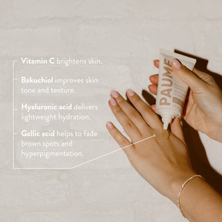 Hand applying skincare product with text about skin benefits on a neutral background