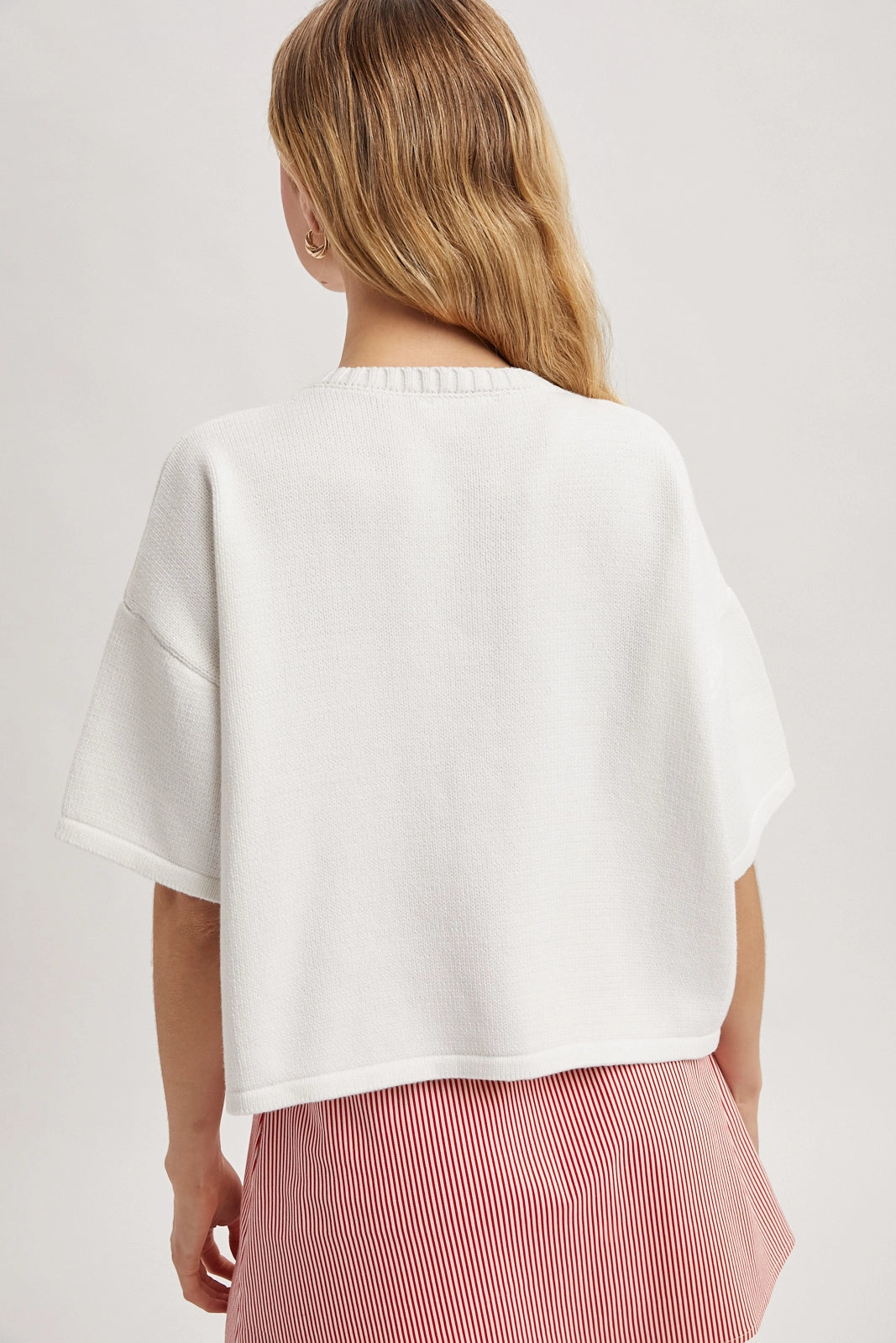 Women wearing a short sleeve button up cardi