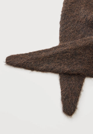 A close-up of a dark brown, fuzzy mohair-style knit fabric accessory, showing its soft texture and folded edges against a plain white background.