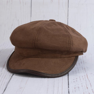 Brown cap on a light wooden surface