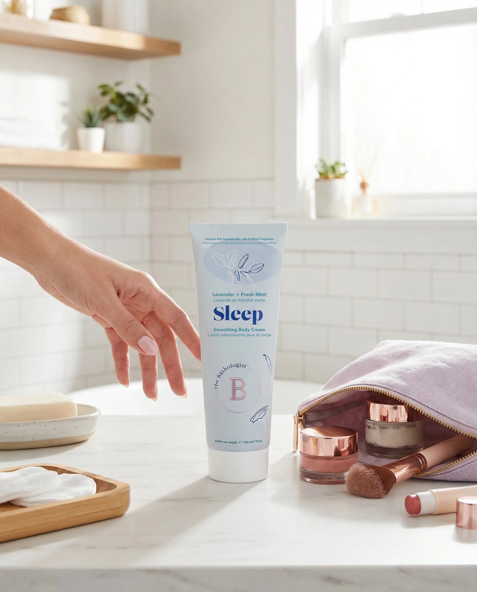 Tube of B Sleep cream on a bathroom counter with makeup items.